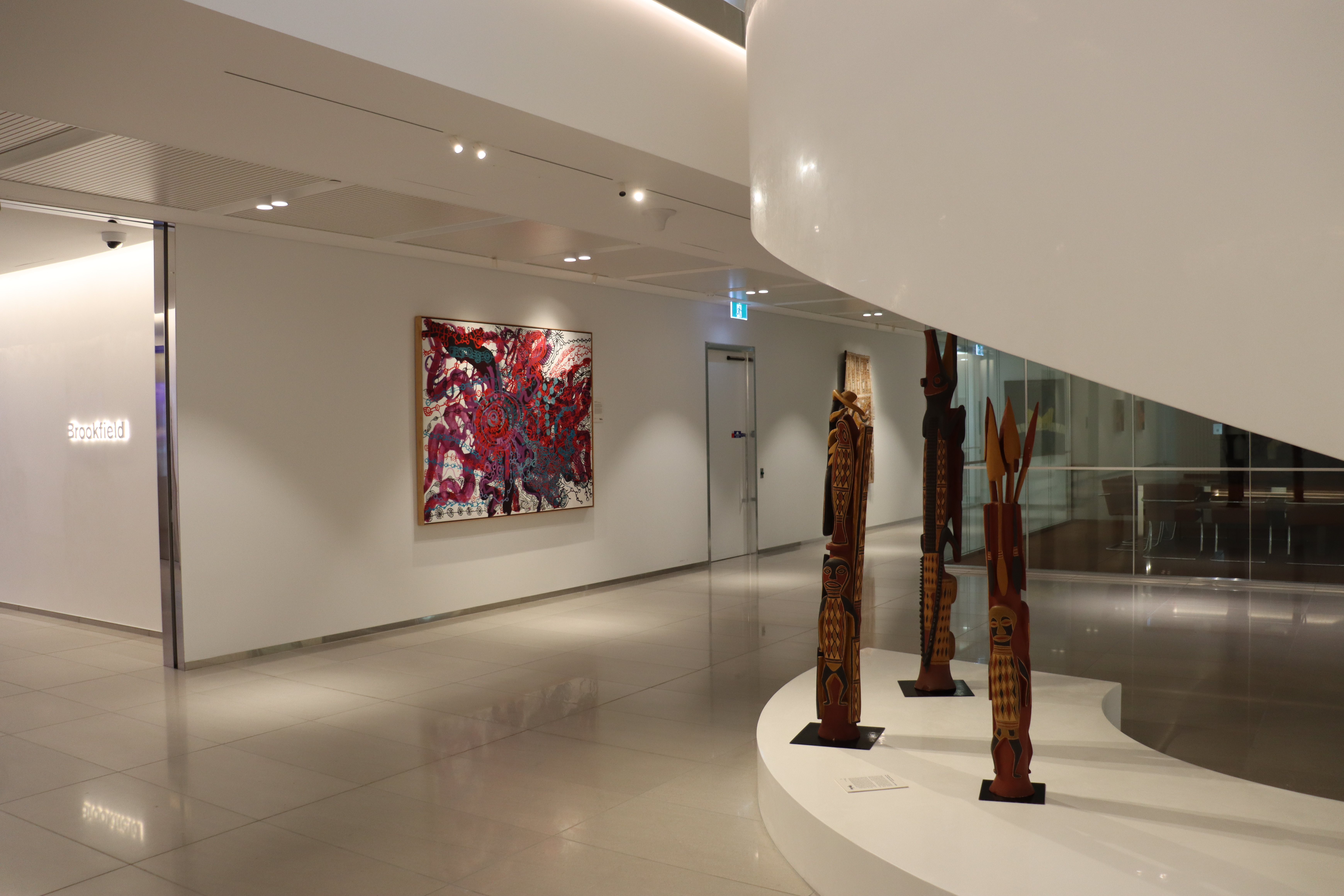 Installation view, Artbank client Brookfield Sydney featuring artwork by Yaritji Young and Bakulangay Marawili, Sydney, 2024.