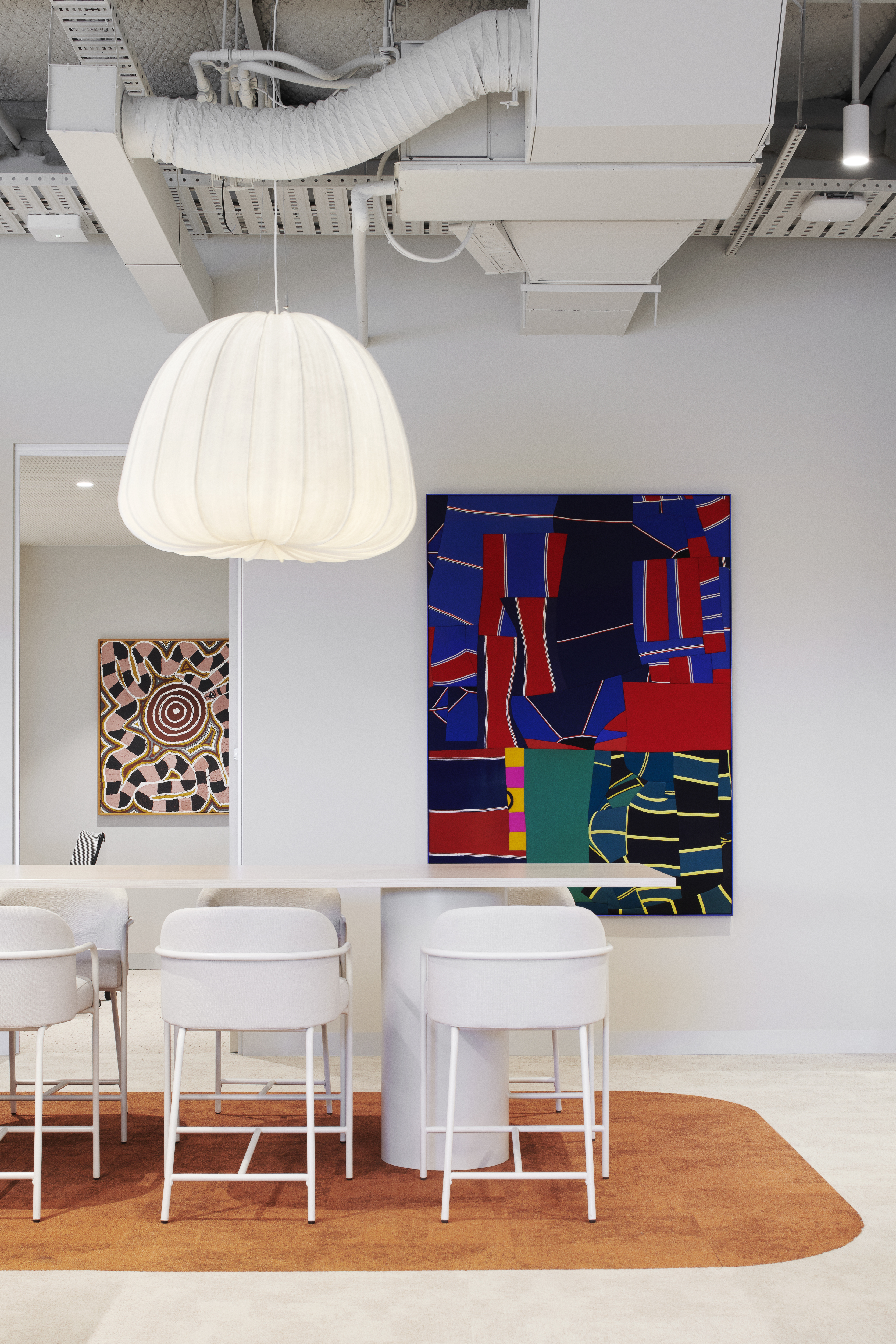 Installation view, Artbank client Winning Group featuring artwork by Jackie Tjakamarra and Henry Jock Walker, Sydney. Photo: Nicole England for Artbank 2026. 