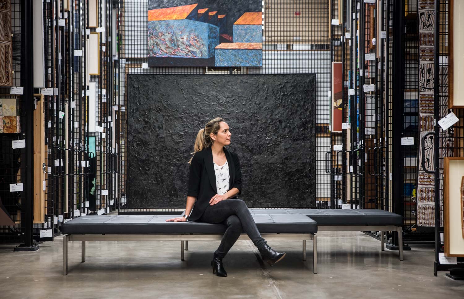 'Darkness on the Edge of Town' curator Clothilde Bullen in Artbank Sydney, 2016. Photo courtesy of Artbank.