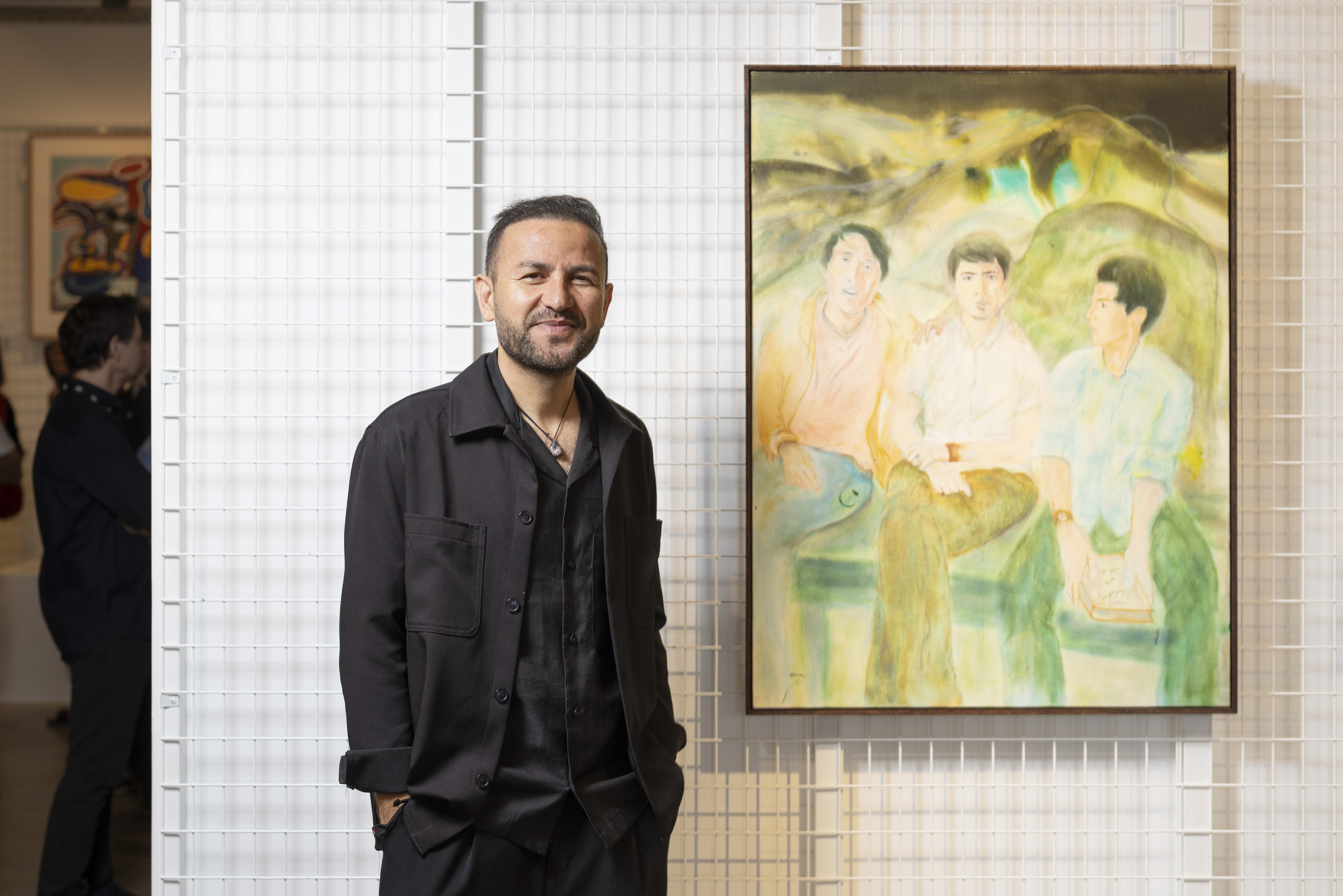 Artbank Prize 2026 winner Elyas Alavi with artwork 'Face to Face', 2025, Artbank Sydney. Photo: Jessica Maurer.