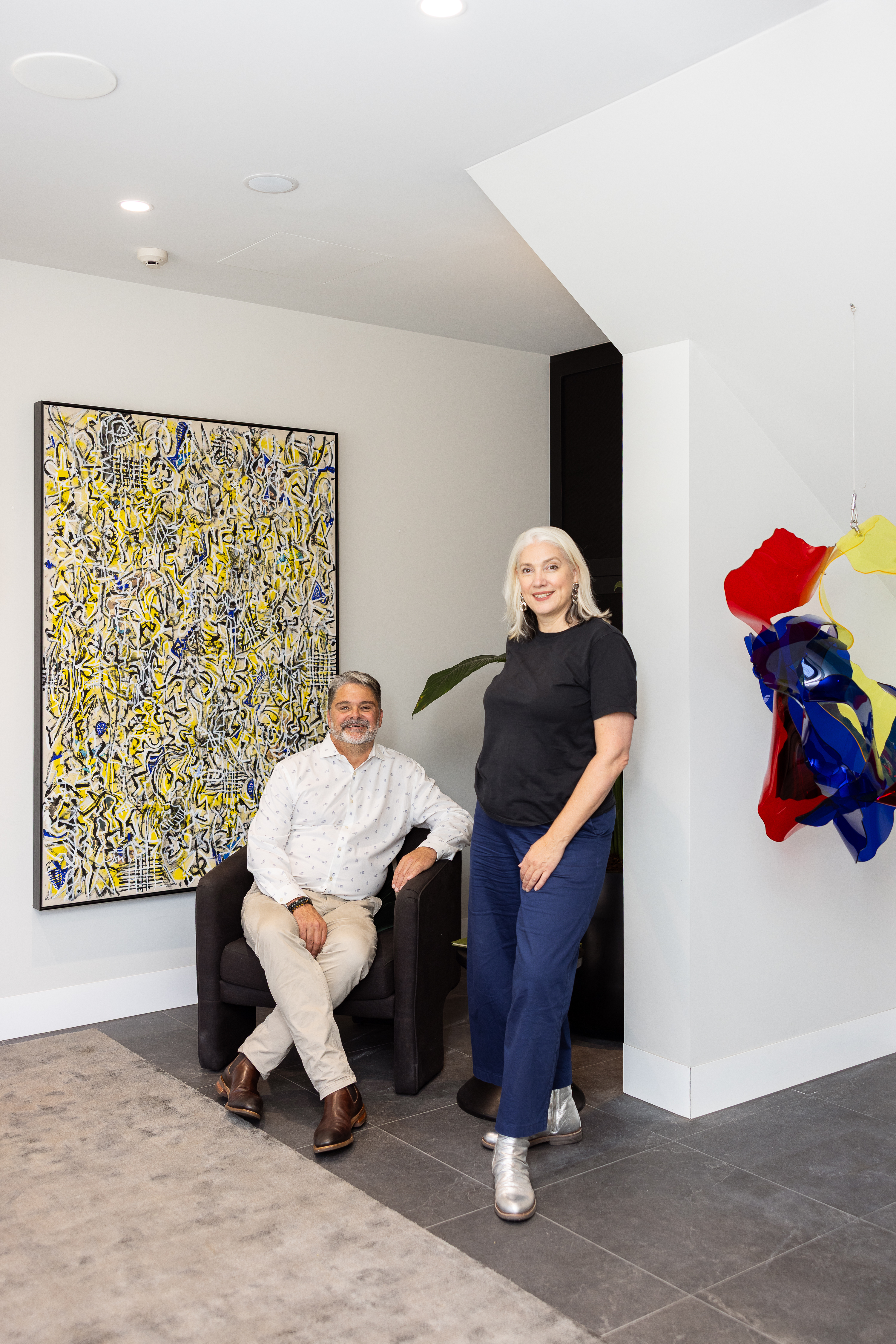 Rob Moolman with Artbank Art Consultant Susie Cornish featuring artwork by Arthur McIntyre and Anne-Marie May, 2025. Photo: Gemma Thomas.
