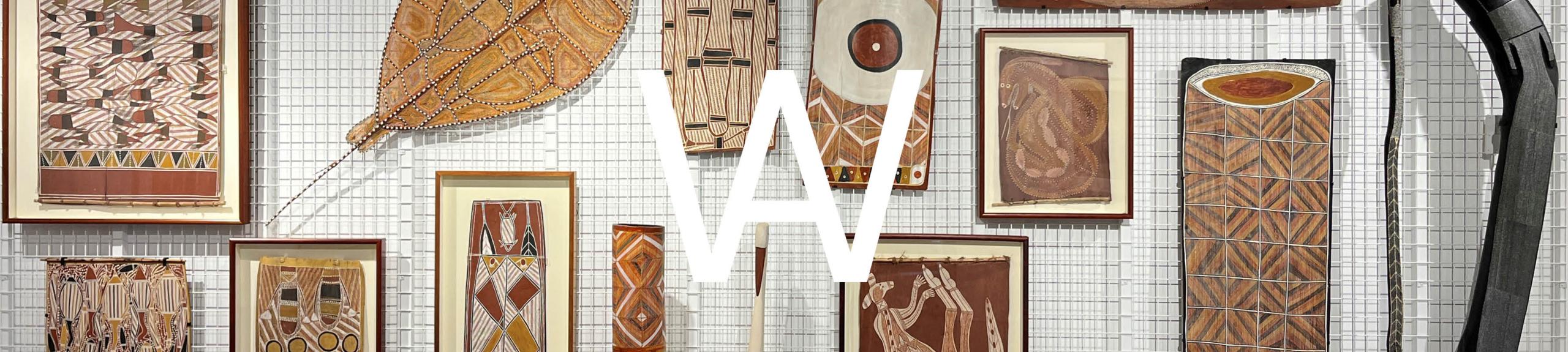 Artbank Window barlmarrk: wind, breath, pulse, power. A selection of artworks ranging from barks, woven objects and sculpture in a salon hang on a white rack 